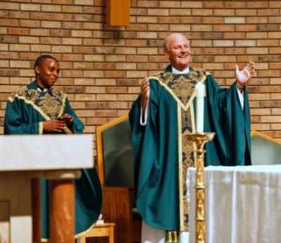 Fr. Bernard and Fr. Peter welcoming all to Mass Mass at St. Ann's Church