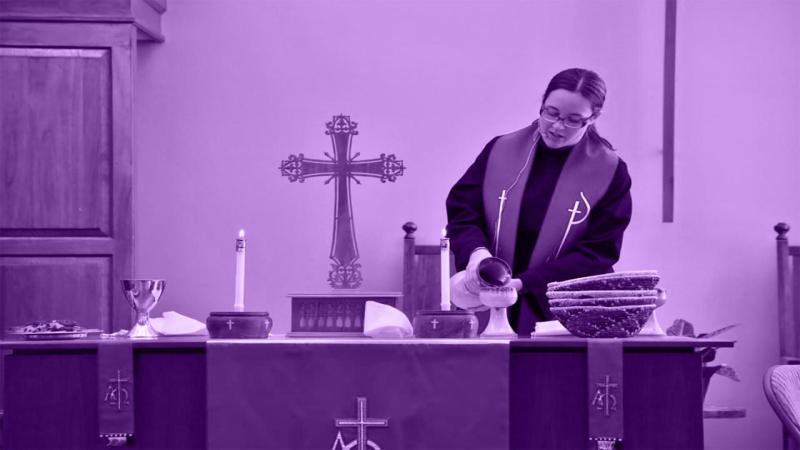 Holy Communion is celebrated the first Sunday of each month. Pictured here is Pastor Sarah preparing the communion table.
