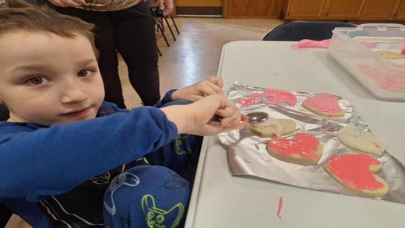 At our children's valentine's party, we frosted cookies for our homebound members!